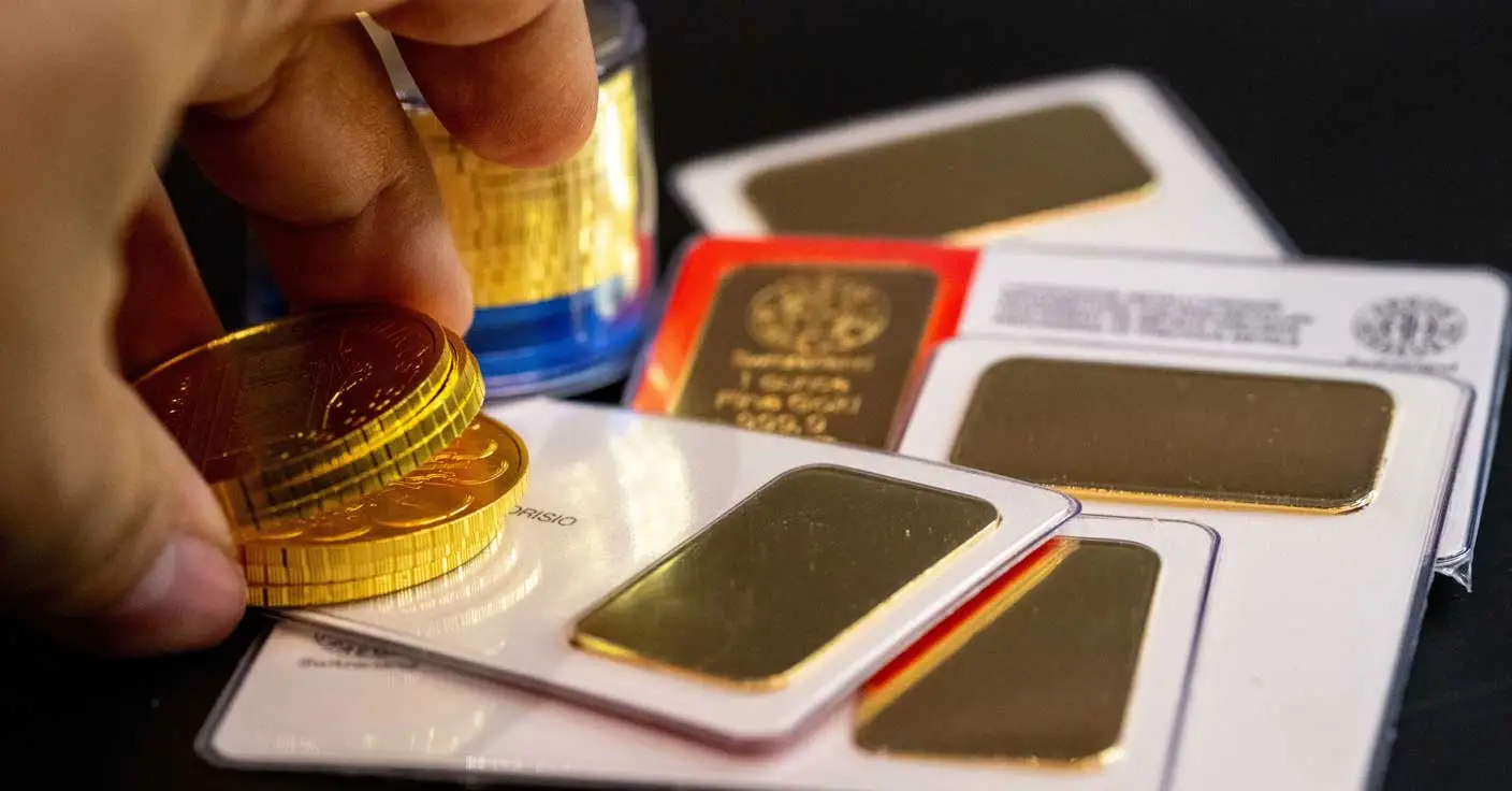 Goldbarren und Goldm&uuml;nzen